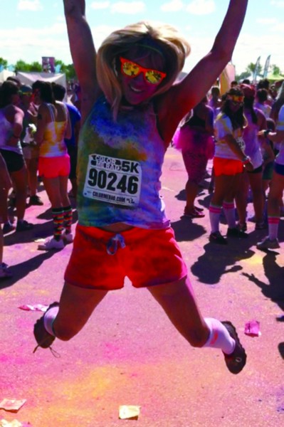 Colour Me Rad participant  Brittany Barber leaps in the air upon completion of the 5k run - Photo: Dave Parchaliuk