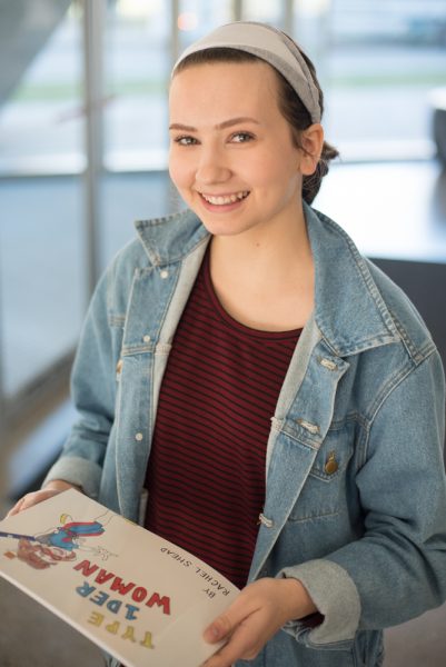 Rachel Stead holds a copy of her book 'Type 1der Woman' photo by Miguel Yetman